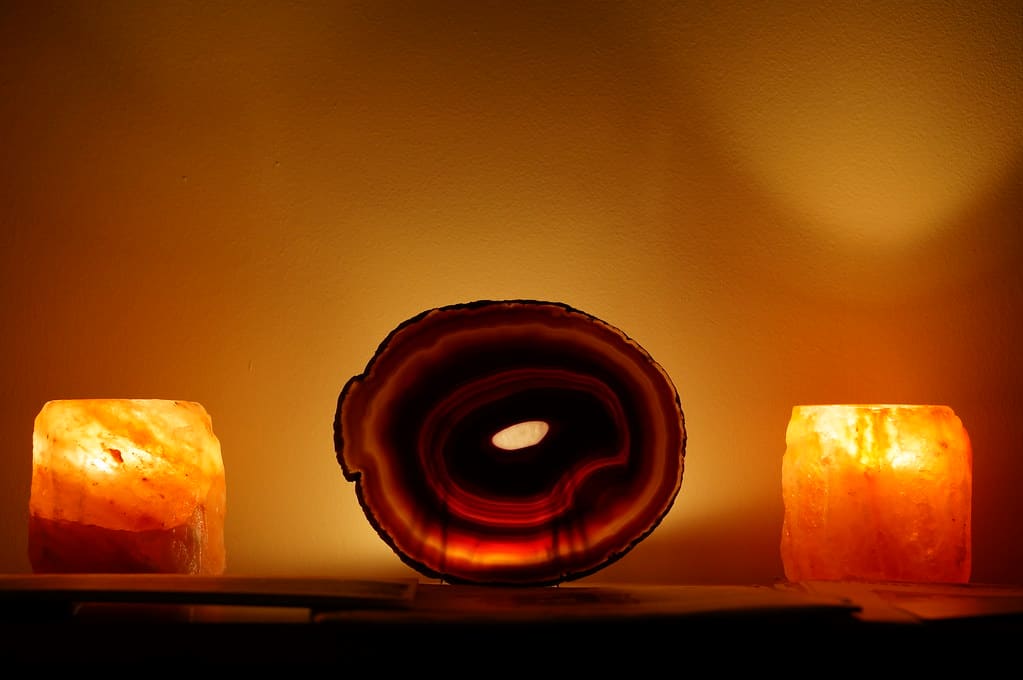 Two Himalayan salt lamps with a beautiful Agate in the center. Salt lamps enhance your performance and concentration!