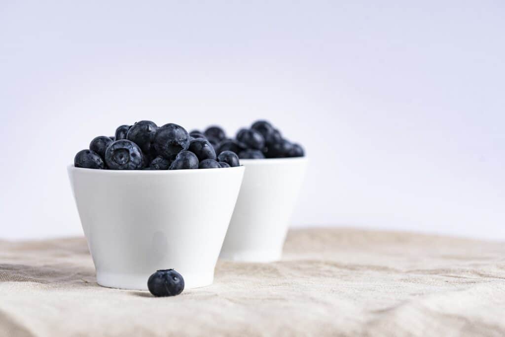 Blueberries in a white bowl, ironically this color combination deals with cravings!